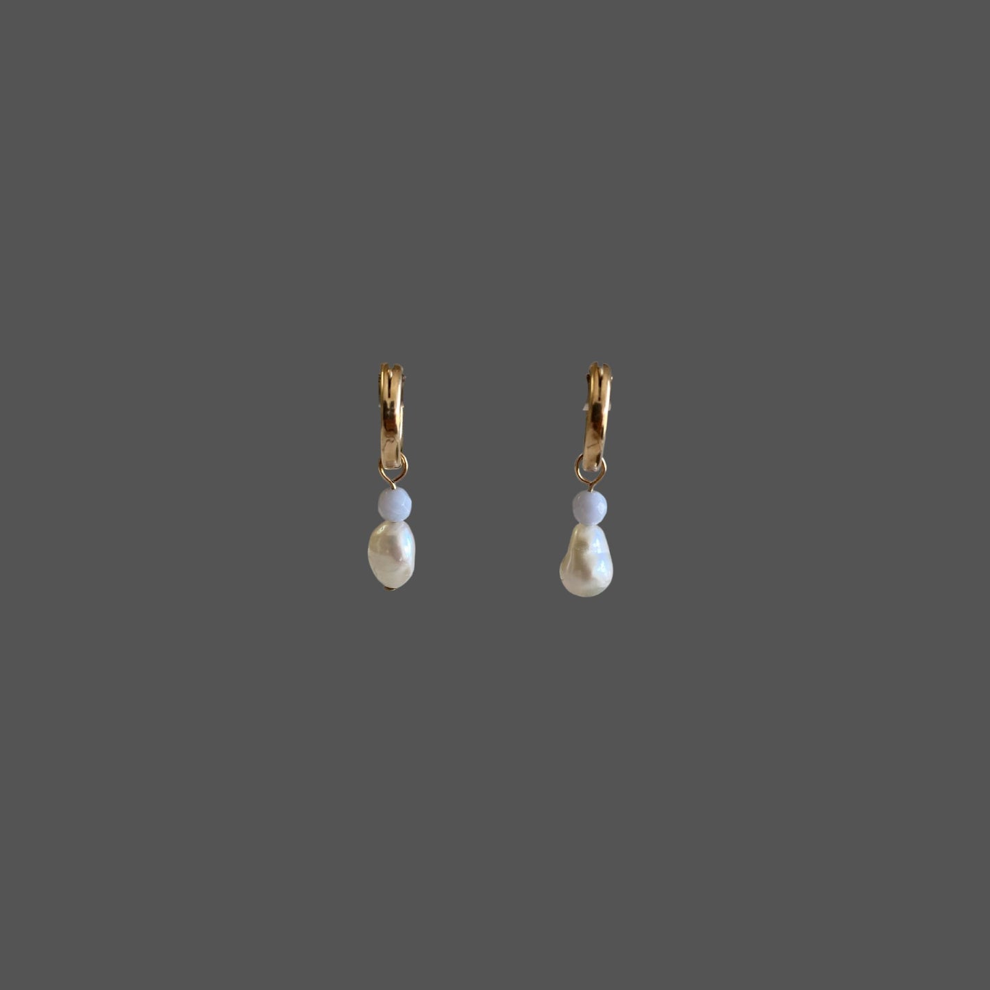 Front view of pearl earrings featuring gold hoops charms with blue lace agate gemstones and freshwater pearls.