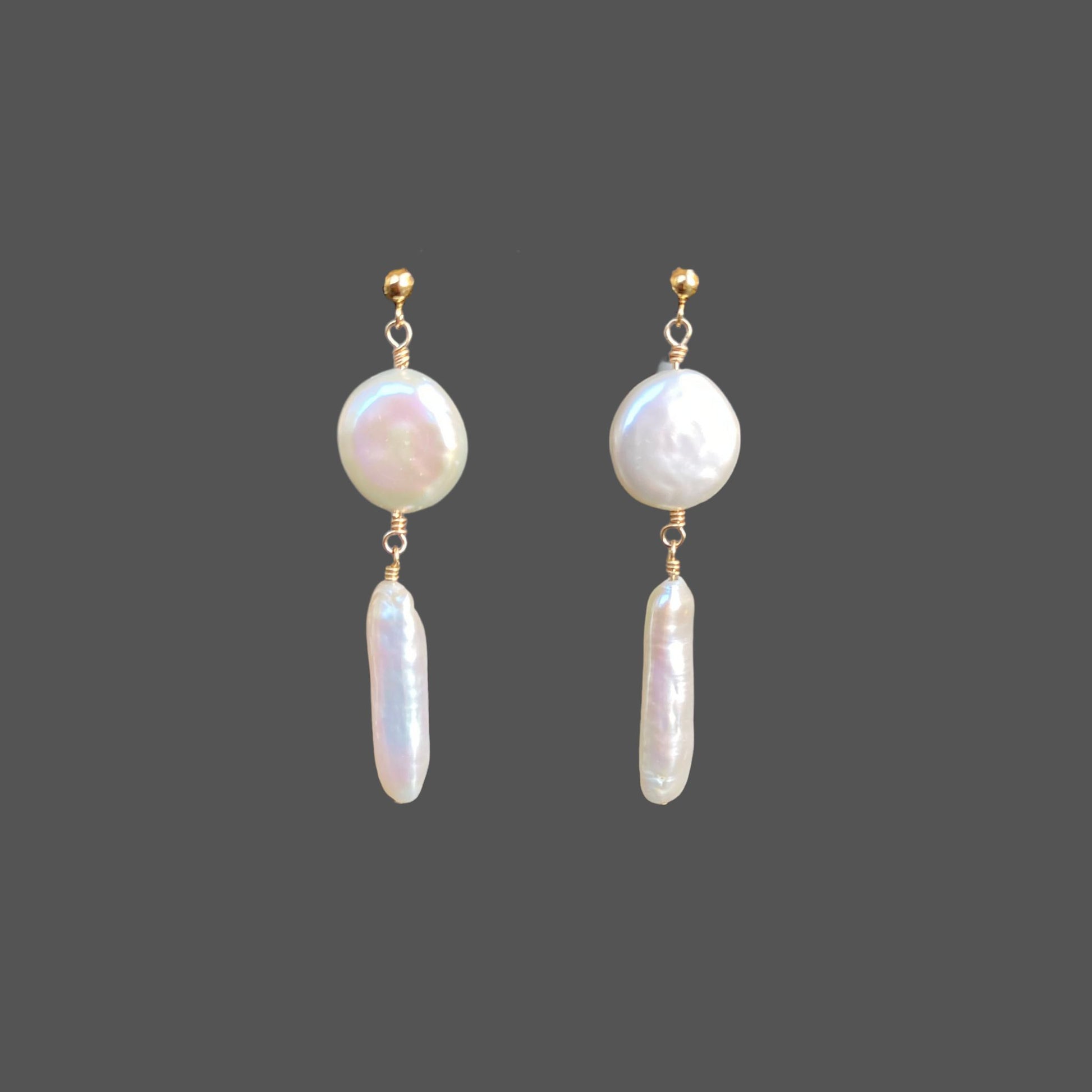 Front view of pearl earrings with a gold ball stud, featuring two pearls hanging below the stud, a round coin pearl and long stick pearl.