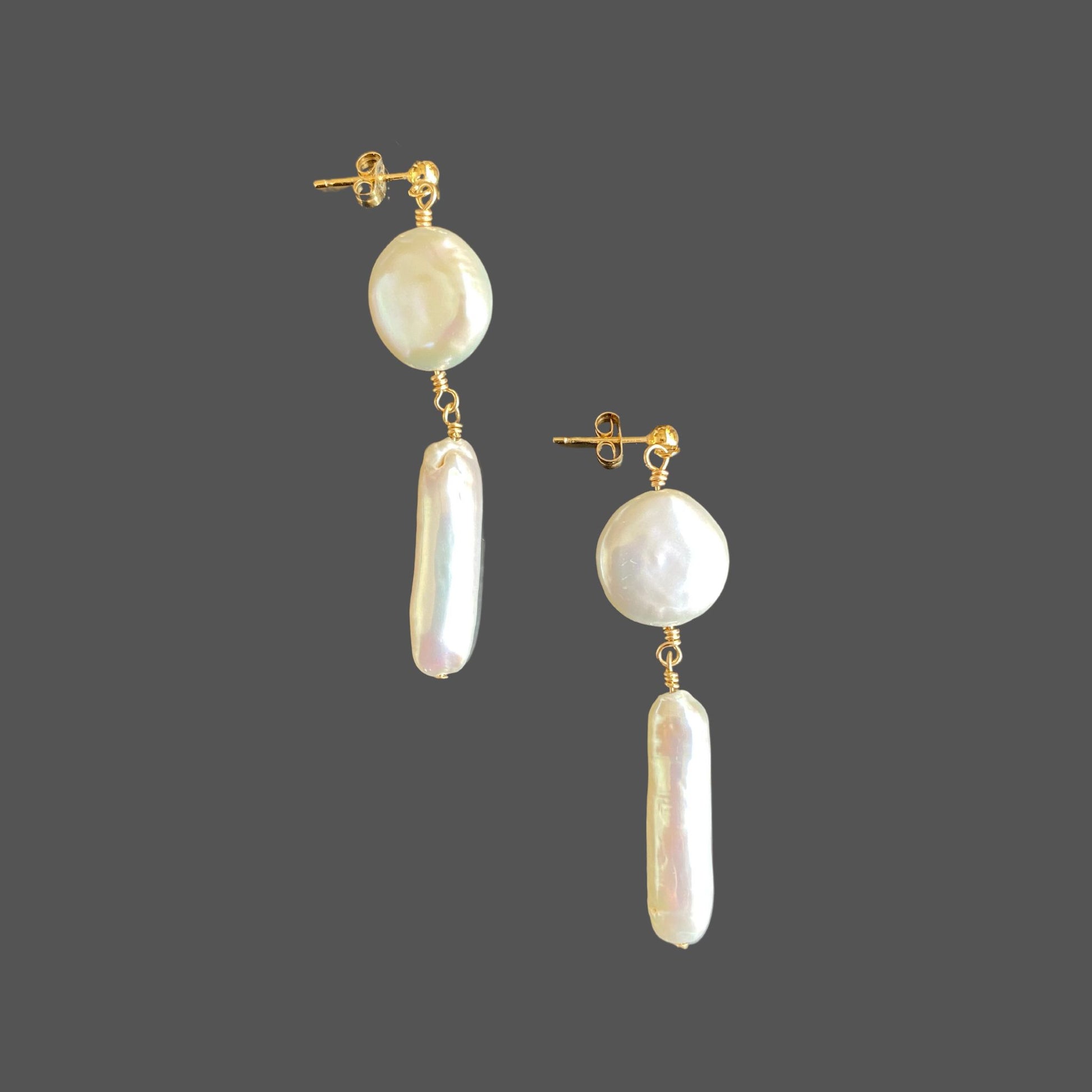 Side view of stud earrings with a gold ball stud and two freshwater pearls hanging below: a coin pearl with a stick pearl beneath it.