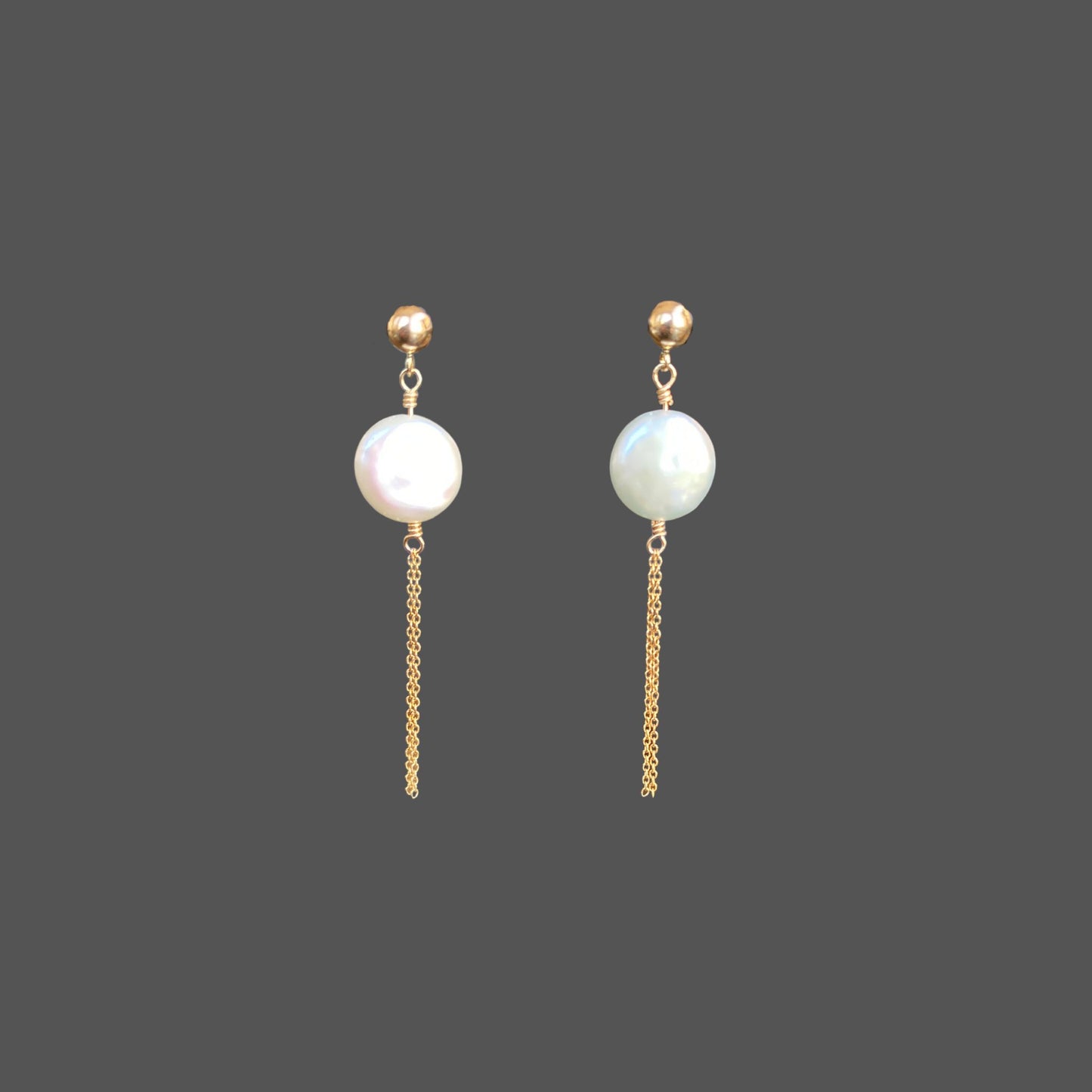 Front view of pearl earrings with a gold ball stud, featuring a round freshwater coin pearl and two strands of gold chain hanging below the pearl.