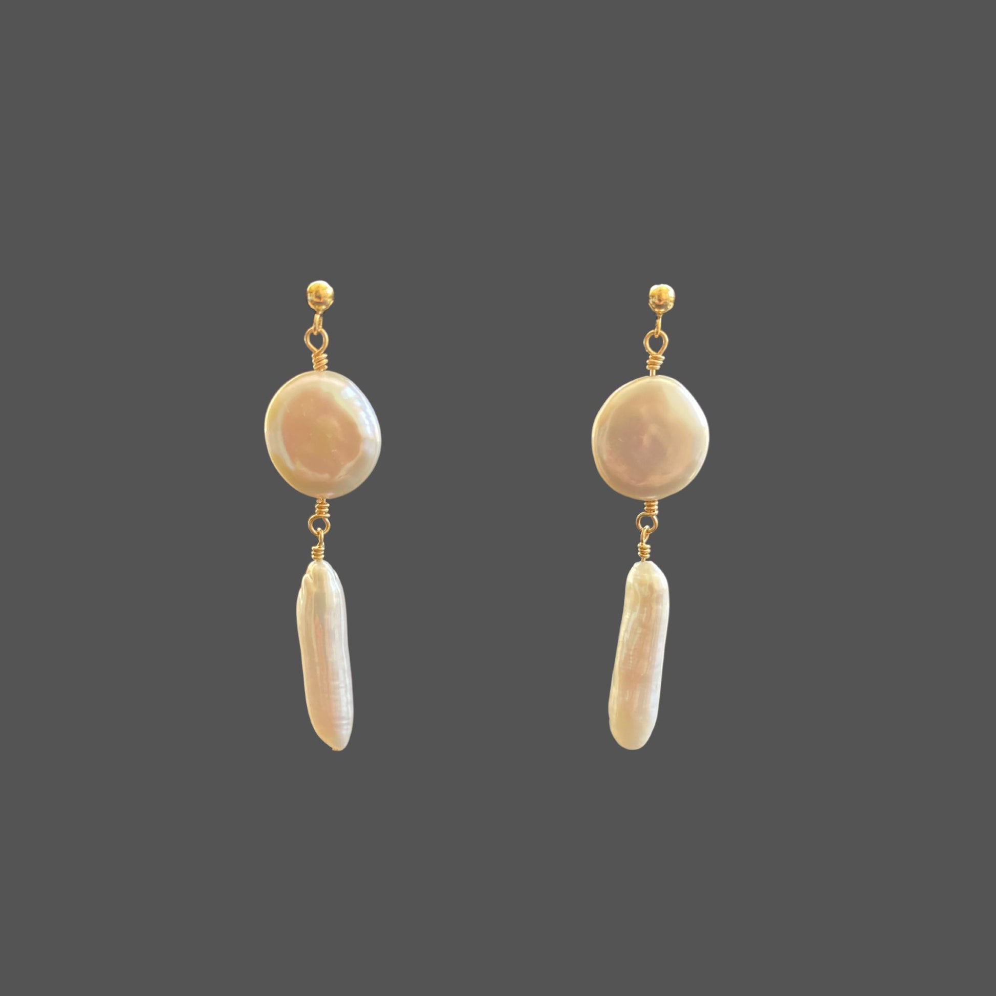 Front view of pearl earrings with a gold ball stud, featuring two pearls hanging below the stud, a round coin pearl and long stick pearl.