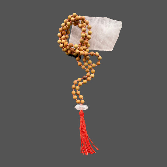 Mala beads for meditation and prayer, with sandalwood beads and rose quartz.